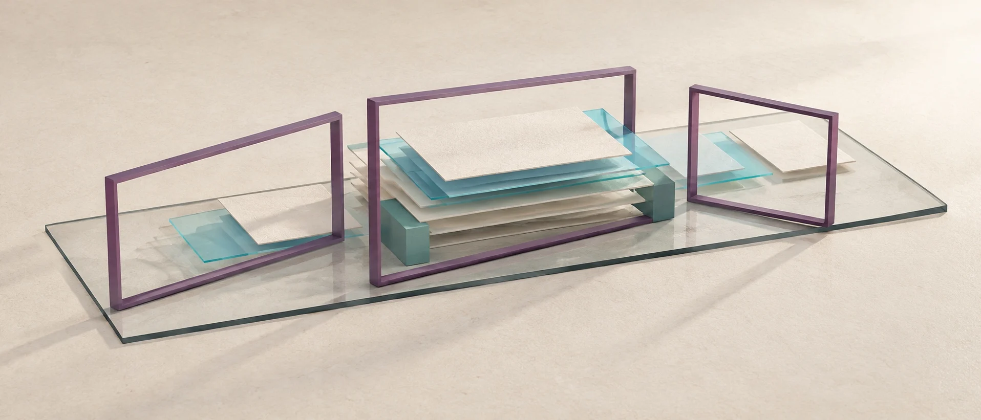 Three open purple frames reveal paper and cyan evidence layers resting on one continuous glass base.